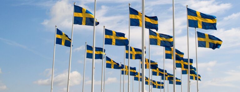 forest-of-flagpoles-with-swedish-blue-and-yellow-flags