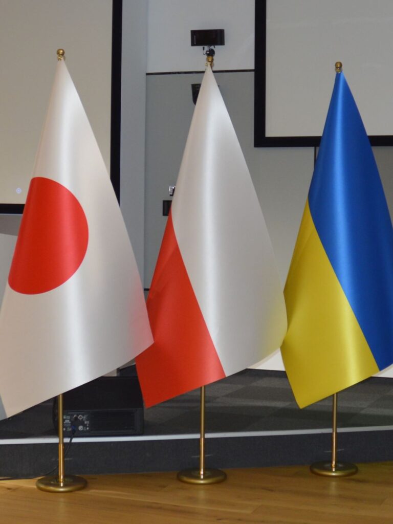 satin flags on flagstands Japan Poland Ukraine